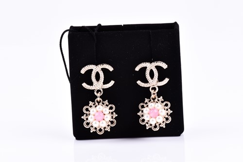 Lot 547 - Chanel. A pair of costume earrings, double C...