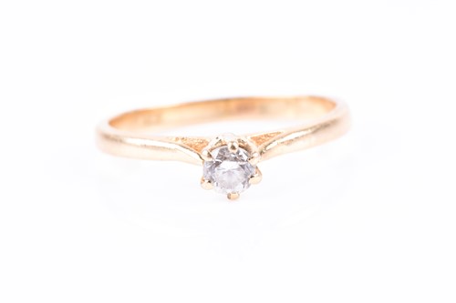 Lot 565 - A yellow metal and solitaire diamond ring, set...