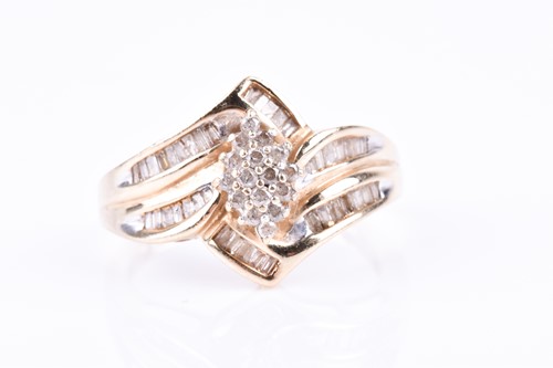 Lot 704 - A yellow metal and diamond ring, the crossover...