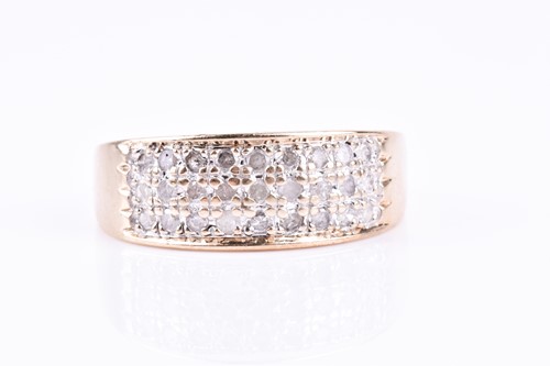 Lot 739 - A 9ct yellow gold and diamond band ring, the...