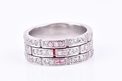 Lot 231 - A diamond eternity ring, the white metal mount...