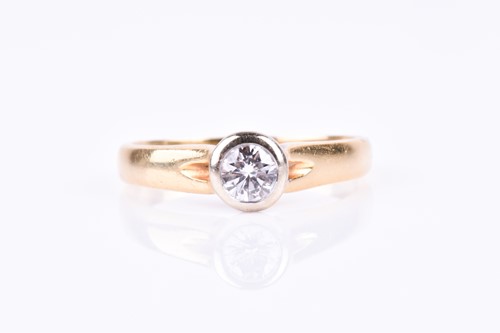 Lot 681 - An 18ct yellow gold and diamond ring, the...