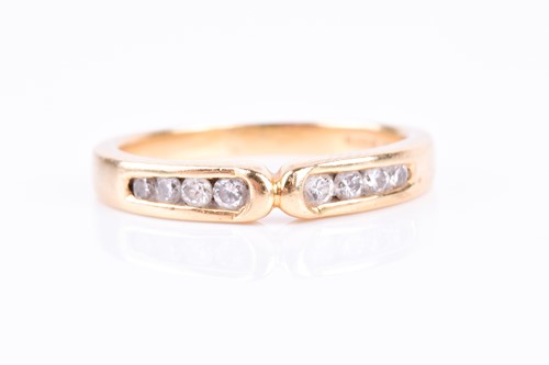 Lot 741 - An 18ct yellow gold and diamond wishbone-style...