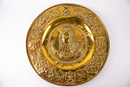 Lot 382 - A large 19th century brass charger, with...