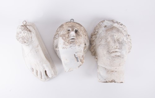 Lot 257 - A group of three decorative plaster casts, two...