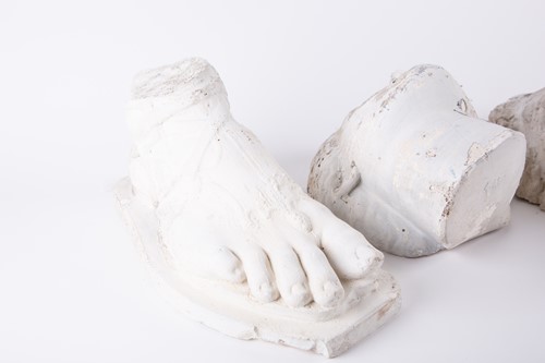 Lot 257 - A group of three decorative plaster casts, two...