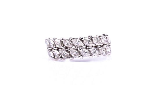 Lot 746 - A white metal and diamond half eternity ring,...