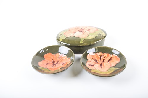 Lot 318 - Three items of Moorcroft Hibiscus pattern...