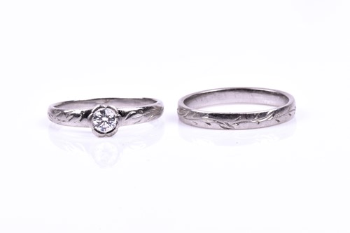 Lot 573 - A platinum and diamond engagement ring, the...