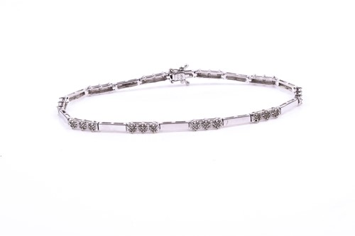 Lot 773 - A 9ct white gold and diamond bracelet, of...