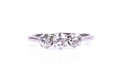 Lot 762 - A three stone diamond ring, the round...