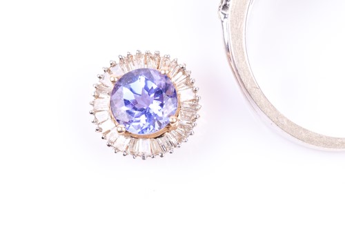 Lot 799 - A 9ct white gold and diamond band ring, set...
