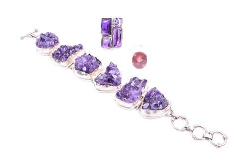 Lot 502 - A silver and amethyst bracelet set with six...