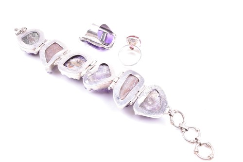 Lot 502 - A silver and amethyst bracelet set with six...