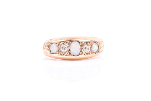 Lot 811 - An 18ct yellow gold, diamond, and opal ring,...