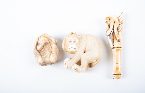 Lot 154 - Three Japanese carved ivory netsuke,...