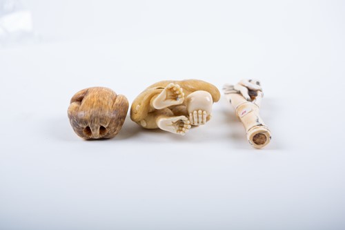 Lot 154 - Three Japanese carved ivory netsuke,...