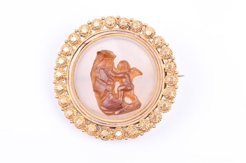 Lot 639 - A yellow metal and onyx hardstone cameo brooch,...