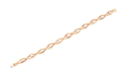 Lot 777 - A 1970s 18ct yellow gold and diamond bracelet,...