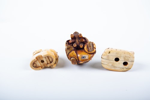 Lot 155 - A Japanese ivory okimono and two netsukes,...