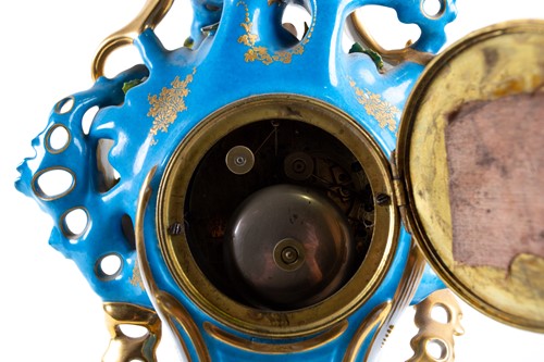 Lot 329 - A 19th-century French porcelain chiming mantle...