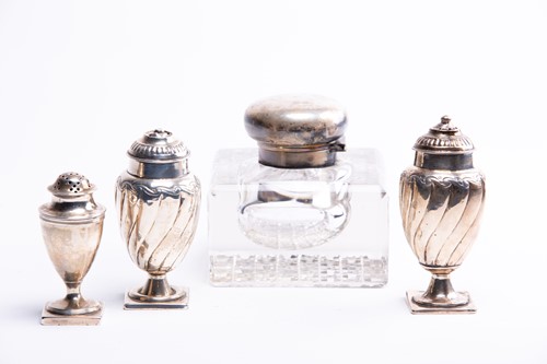 Lot 84 - A pair of silver pepperettes, together with...