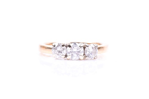 Lot 855 - An 18ct yellow gold and diamond ring, set with...