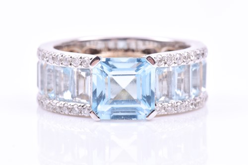 Lot 579 - A diamond and blue topaz cocktail ring, set...