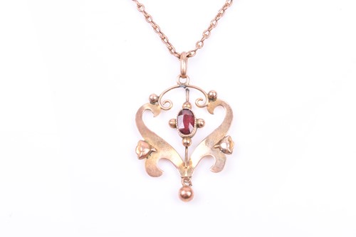 Lot 832 - An Art Nouveau 9ct yellow gold and garnet drop...