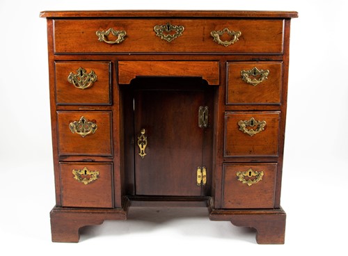 Lot 86 - A George III mahogany knee hole desk, the top...
