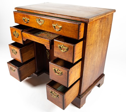 Lot 86 - A George III mahogany knee hole desk, the top...