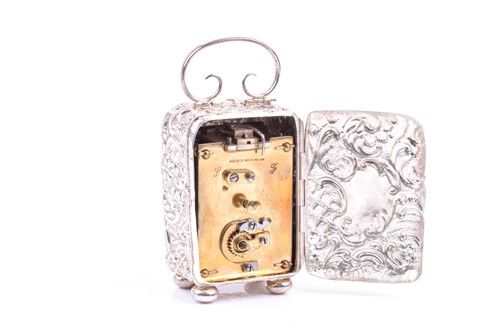 Lot 19 - A Victorian miniature repousse silver cased...