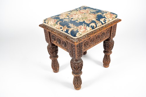Lot 108 - An Edwards and Roberts carved oak stool, with...