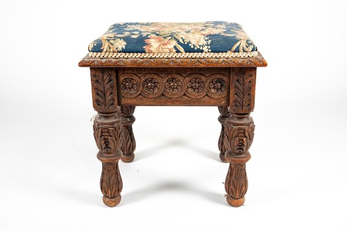 Lot 108 - An Edwards and Roberts carved oak stool, with...