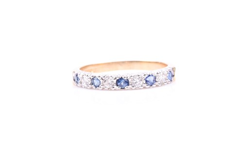 Lot 571 - An 18ct yellow gold, diamond, and sapphire...