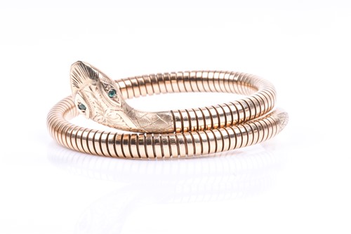 Lot 834 - A 9ct yellow gold covered snake bracelet, the...