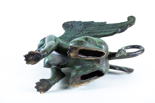 Lot 226 - A patinated bronze of a winged sphinx, 20th...