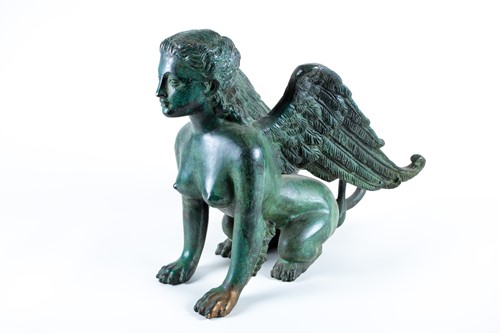 Lot 226 - A patinated bronze of a winged sphinx, 20th...