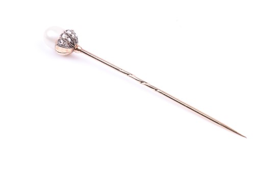 Lot 684 - A gentleman's tie pin, set with a natural...