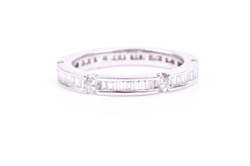 Lot 453 - An 18ct white gold and diamond eternity ring,...