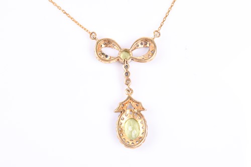 Lot 372 - A diamond and peridot drop pendant necklace,...