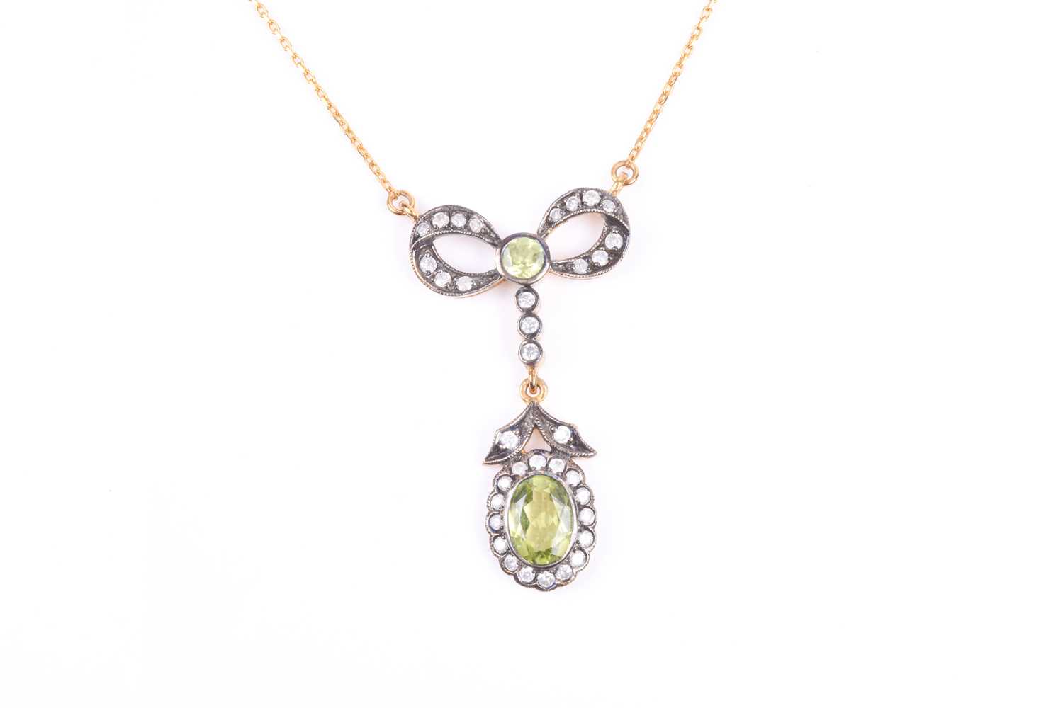 Lot 372 - A diamond and peridot drop pendant necklace,...