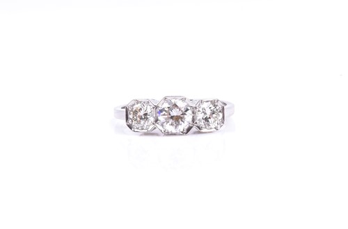 Lot 685 - A platinum and diamond ring, set with three...