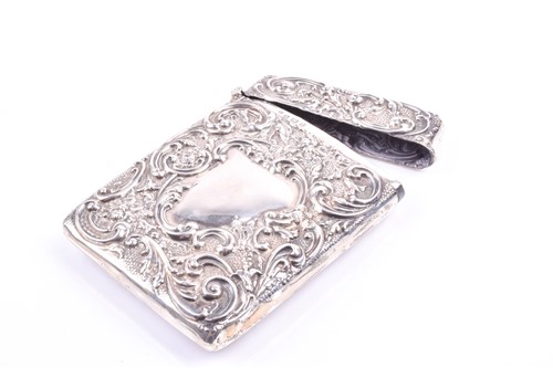 Lot 416 - An Edwardian silver card case, with repousse...