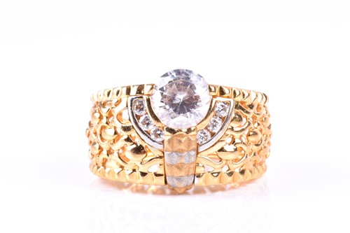Lot 438 - A yellow metal dress ring, the wide...