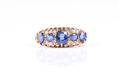 Lot 621 - An Edwardian sapphire and diamond 18ct gold...