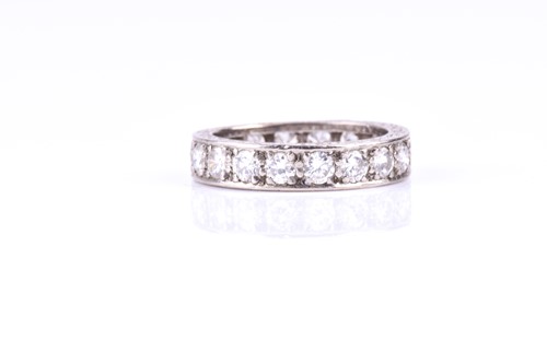 Lot 806 - A diamond full hoop eternity diamond ring; the...