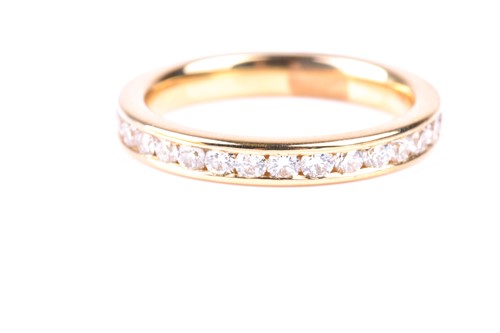 Lot 473 - A full hoop diamond eternity ring, the round...