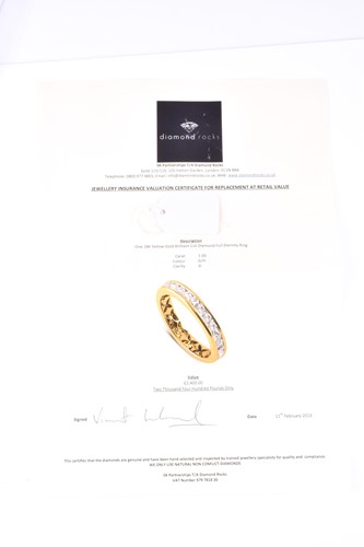 Lot 473 - A full hoop diamond eternity ring, the round...