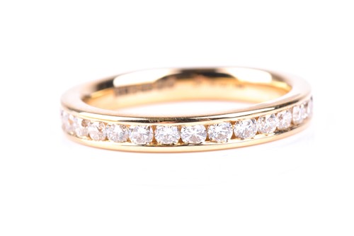 Lot 473 - A full hoop diamond eternity ring, the round...